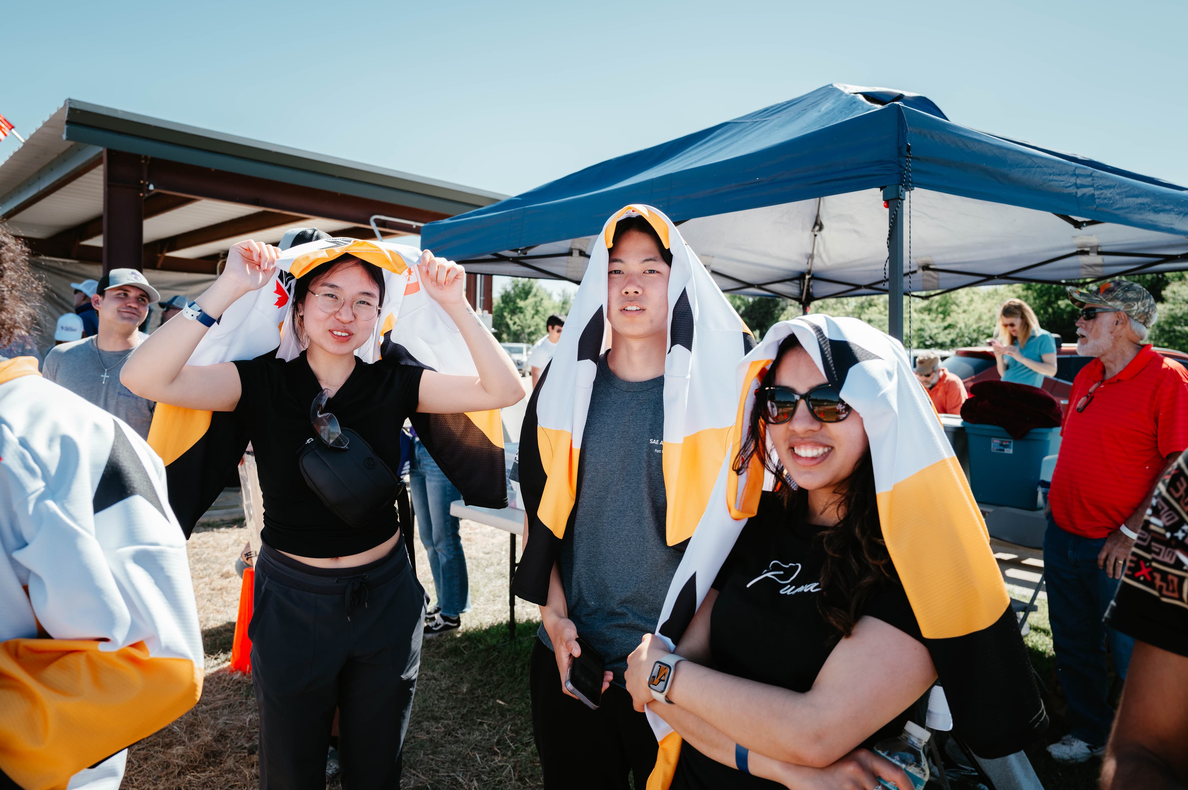 WatArrow members staying cool with their hockey jerseys in the sun